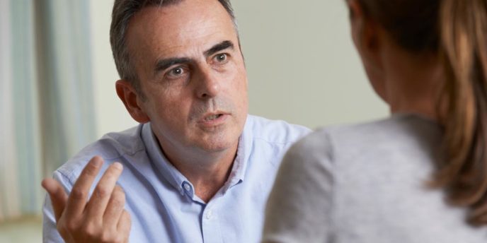 man in blue shirt talks to doctor about buprenorphine use