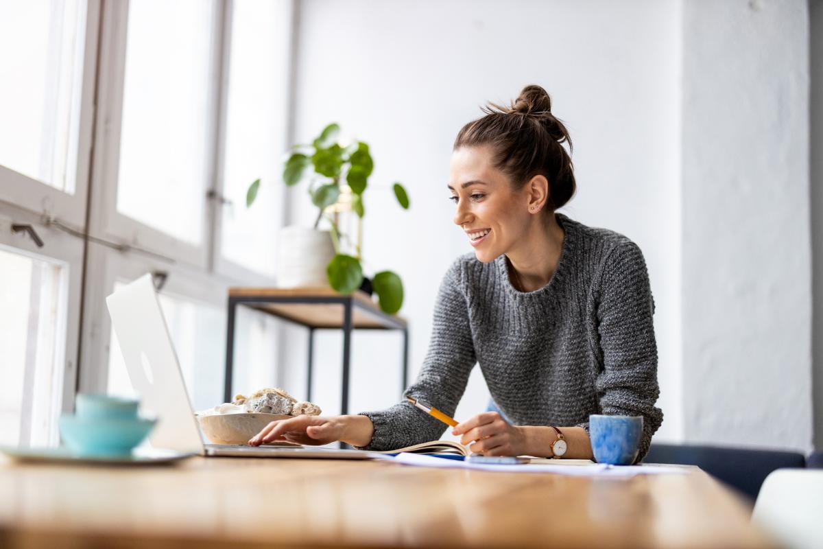 Person on laptop participating in online drug rehab