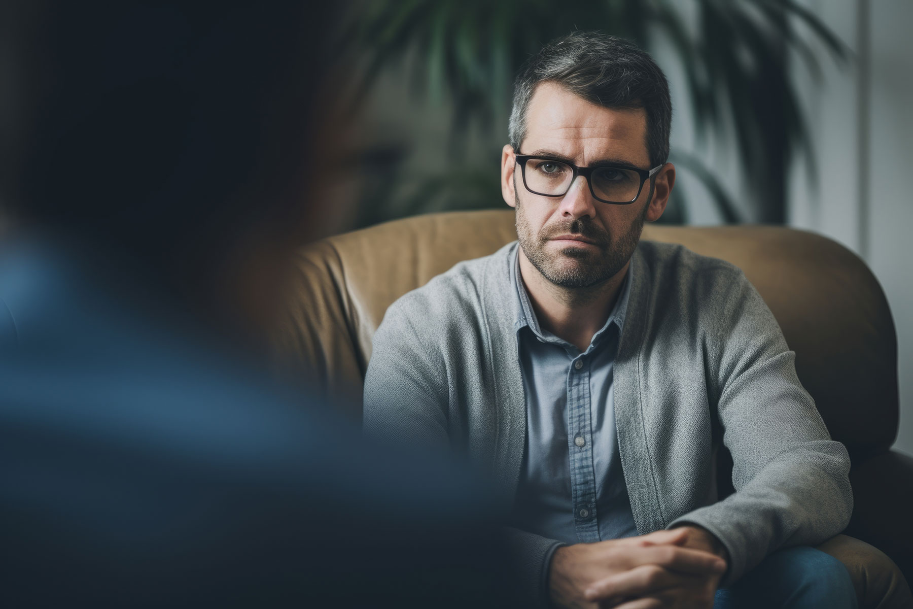 person working through unresolved trauma with therapist