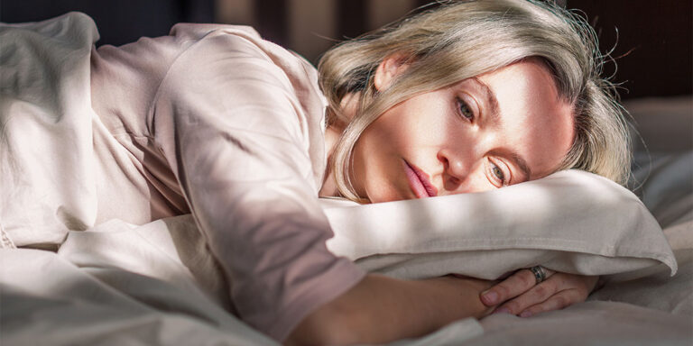 person in bed wondering about what are most addictive painkillers