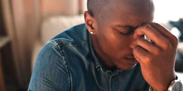 person with tension headache wondering how to detox from prescription drugs