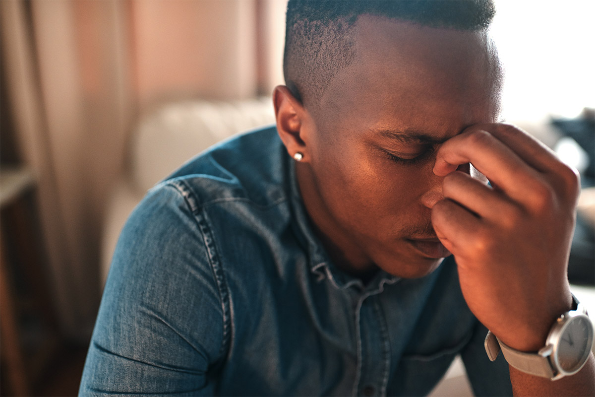 person with tension headache wondering how to detox from prescription drugs