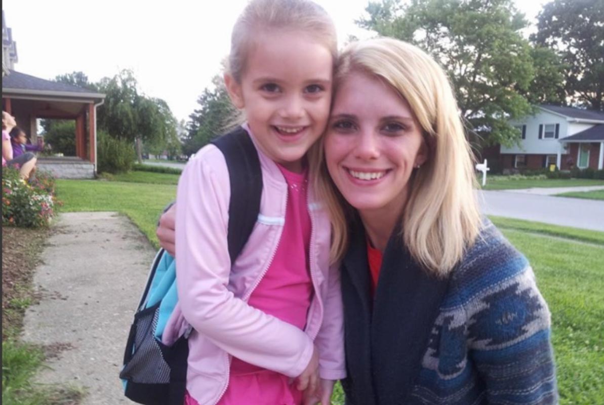 Ariel Smith, Outreach Coordinator for BrightView, poses with her daughter on her first day of school.