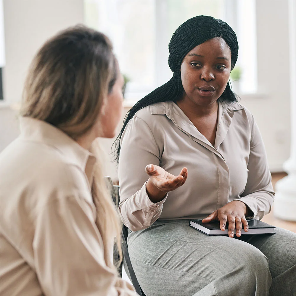Provider talking to patient in treatment